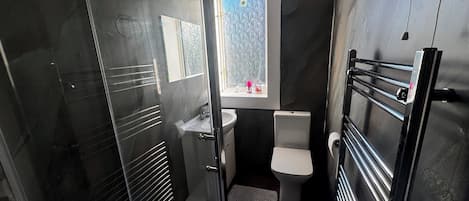 Shower, hair dryer, towels, soap