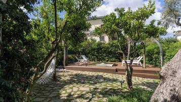 Seasonal outdoor pool, open 9:00 AM to 8:00 PM, pool umbrellas