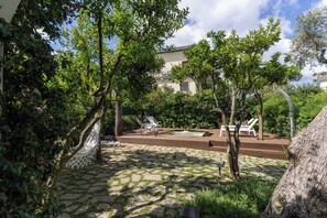 Seasonal outdoor pool, open 9:00 AM to 8:00 PM, pool umbrellas