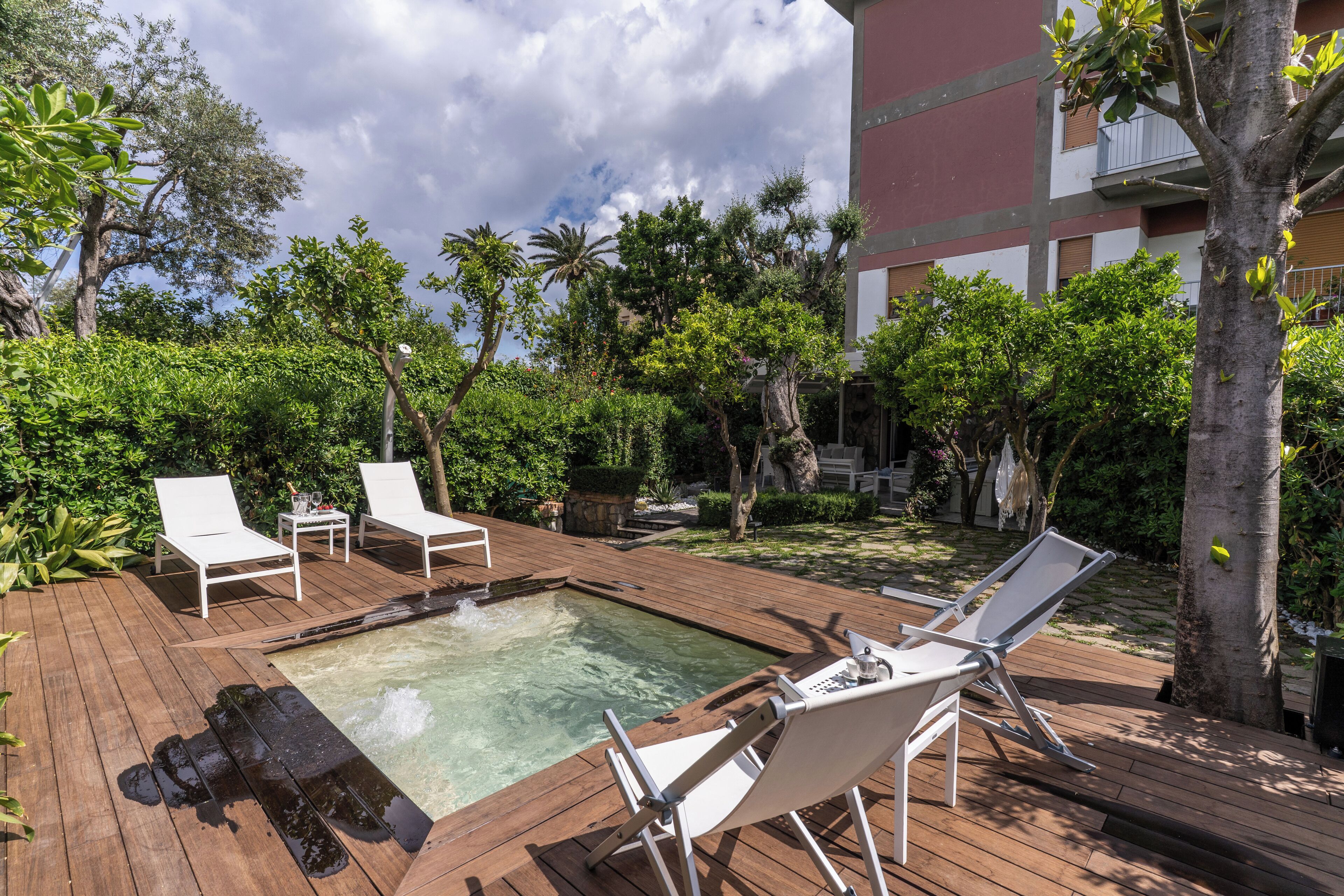 Seasonal outdoor pool, open 9:00 AM to 8:00 PM, pool umbrellas