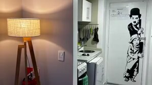 A hallway with a lamp, a fire extinguisher, and a kitchen area with cabinets and a stove. - Entire condo in San Carlos de Bariloche, Argentina (San Carlos de Bariloche)