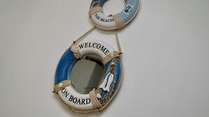 Two life rings with text, one reads "WELCOME ON BOARD" and the other "LET'S GO TO THE BEACH".