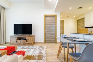 Apartment, Balcony, City View | Living area | 55-inch LCD TV with digital channels - Superhost  Stylish 1BR in Bloom Tower (Dubai)