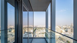 A high-rise balcony with a city view. - Superhost  Stylish 1BR in Bloom Tower (Dubai)