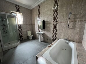 Shower, towels, soap, toilet paper