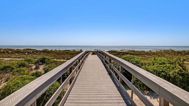 A wooden boardwalk leading to a beach with clear skies. - Ocean Place 7 ~ Shore to Please (Fernandina Beach)