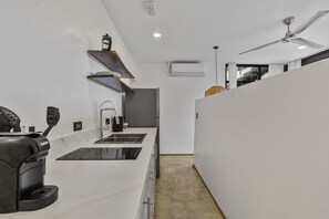 Deluxe Studio, 1 King Bed, Balcony, Pool View | Private kitchen | Full-size fridge, stovetop, cookware/dishes/utensils