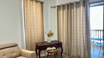 Apartment, Balcony, Sea View | Living area | TV