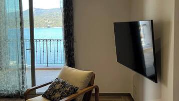 Apartment, Balcony, Sea View | Living area | TV