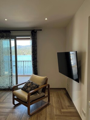 Apartment, Balcony, Sea View | Living area | TV