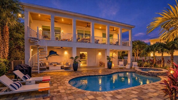 A two-story house with a swimming pool, outdoor seating, and a covered patio area. - P01 - New 3 bed, 3 bath with private pool (Marathon)