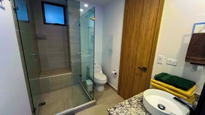 Shower, towels, soap, toilet paper
