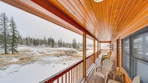 A wooden deck with chairs and a view of a snowy landscape. - Stunning San Juan Mtn Views: Cabin Near Skiing! (Durango)