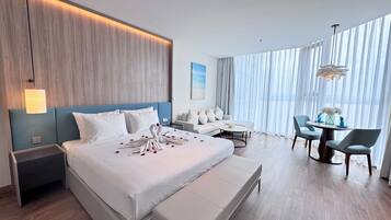 Deluxe Apartment, Sea View | Minibar, individually decorated, individually furnished, desk