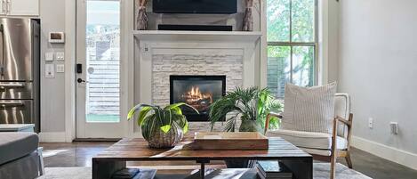 TV, fireplace, books