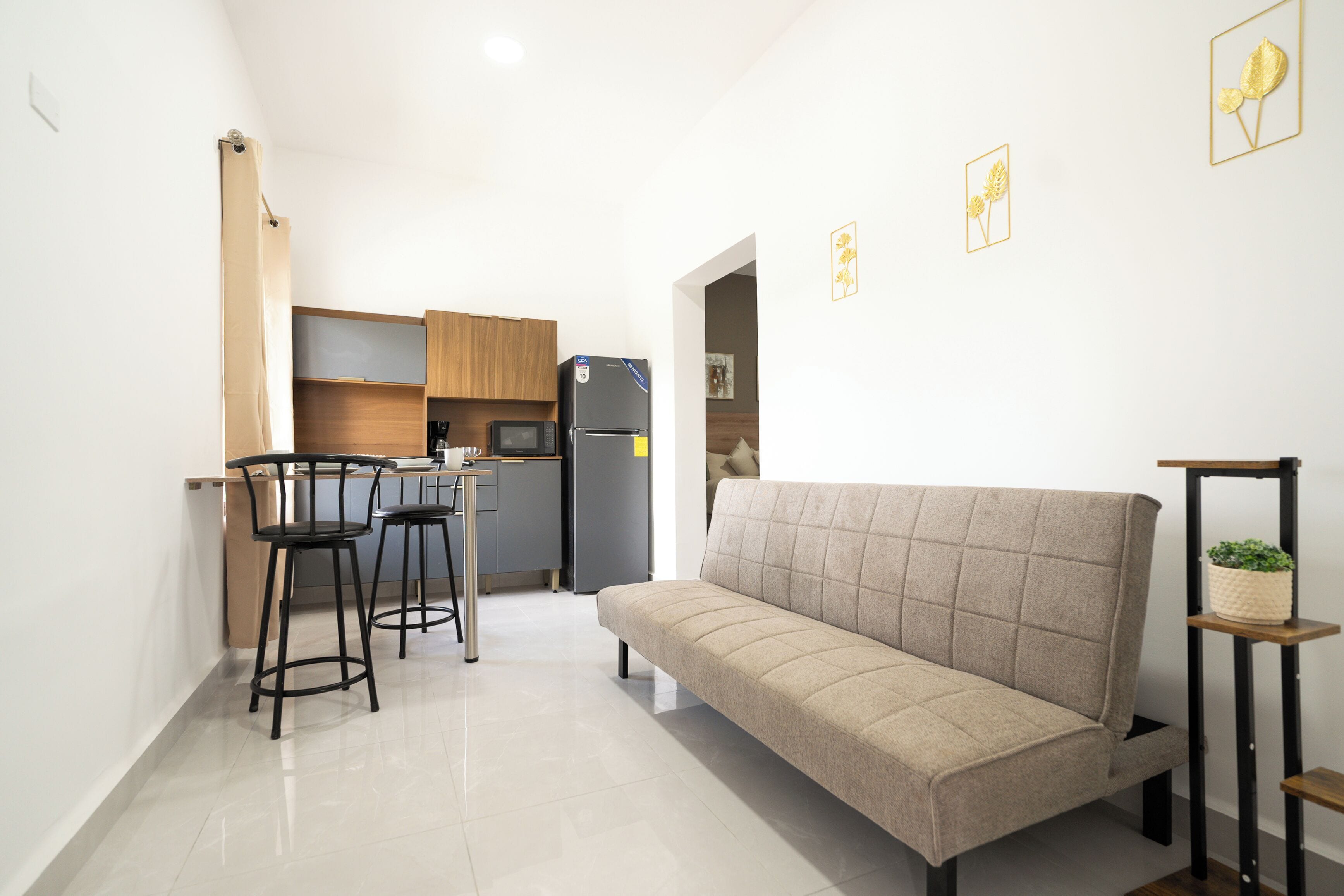 Comfort Suite, 1 Queen Bed | Private kitchen | Coffee/tea maker, microwave, cookware/dishes/utensils, dining table