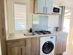 Fridge, microwave, stovetop, coffee/tea maker