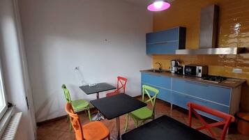 Mini-fridge, microwave, stovetop, cookware/dishes/utensils