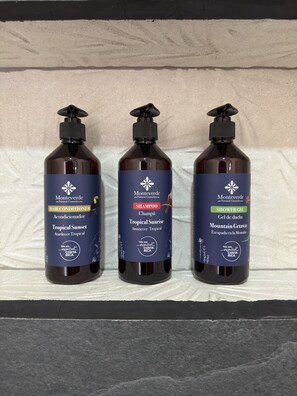 Three bottles of Monteverde Natural Cosmetics hair conditioner, shampoo, and shower gel. - Biofilia Monteverde (Monteverde)