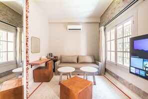 Junior Suite, Courtyard View | In-room safe, laptop workspace, soundproofing, iron/ironing board