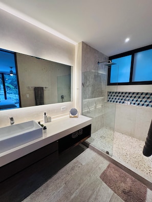 Shower, hair dryer, towels, soap