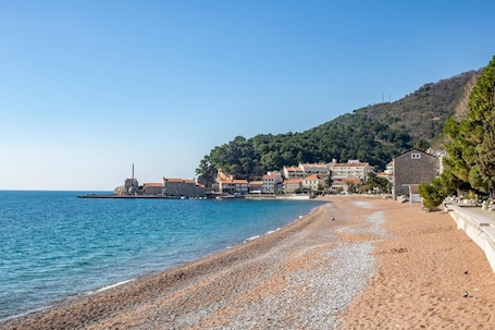 On the beach, white sand. Beachfront Apartments Oaza 2