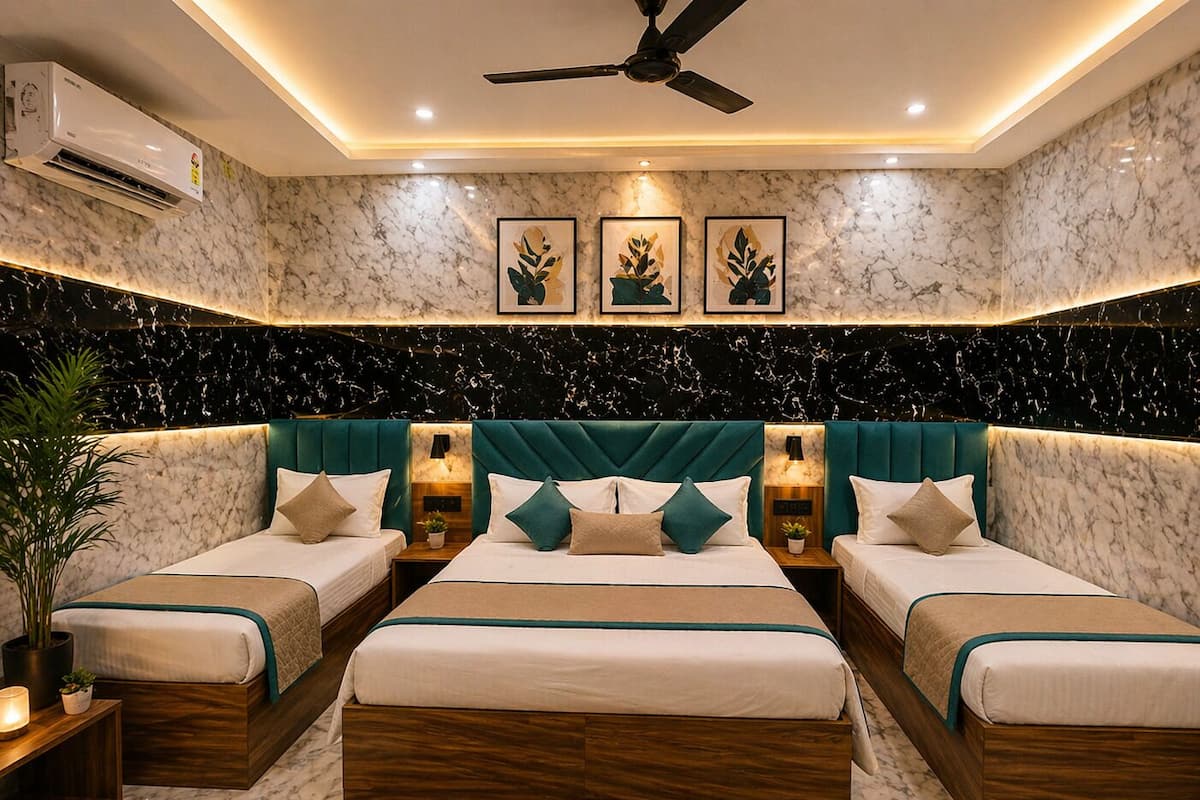 A bedroom with a large bed, two smaller beds, marble walls, ceiling fan, and wall-mounted air conditioning.