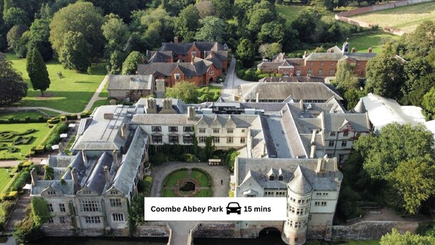 A large, historic estate with multiple buildings, a central courtyard, and a moat. - Contemporary Comfort Steps from Ricoh Arena (Coventry)