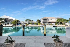 Outdoor pool, a heated pool - Keys Breeze  2 Bedroom / 2 Bath Half Duplex with Dockage & Cabana Club Membership (Key Colony Beach)