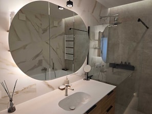 Shower, hair dryer, towels, toilet paper