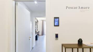 Comfort Triple Room, Non Smoking, Balcony | Living area | 43-inch TV with digital channels