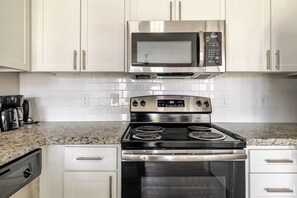 Coffee/tea maker, fridge, microwave, oven