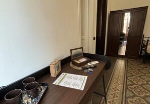 Comfort Room | Individually decorated, desk, laptop workspace, iron/ironing board