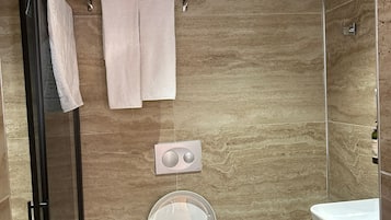 Deluxe Triple Room, Non Smoking, Courtyard View | Bathroom | Shower, hair dryer, slippers, towels