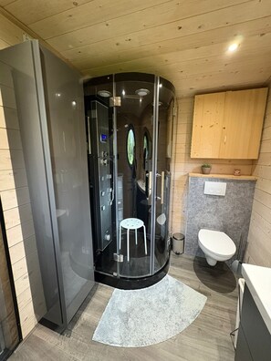 Shower, hair dryer, towels, toilet paper
