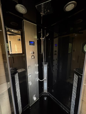 Shower, hair dryer, towels, toilet paper