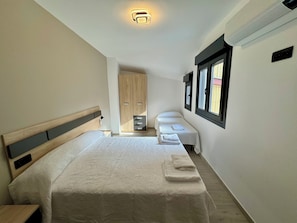 Family Apartment, City View | Iron/ironing board, free WiFi