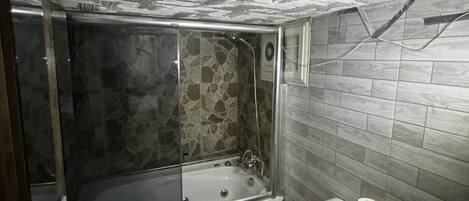 A bathroom with a bathtub, a sink, and a toilet.