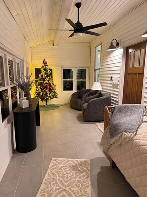 A cozy living room with a large Christmas tree, a ceiling fan, and a comfortable seating area. - Pickett’s Place-Modern Country Farmhouse with Rustic Charm, minutes from town. (Pomeroy)
