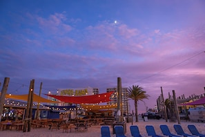 On the beach, sun-loungers, beach towels