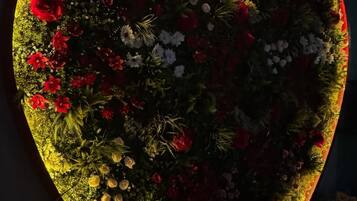 A heart-shaped floral arrangement with a warm glow.