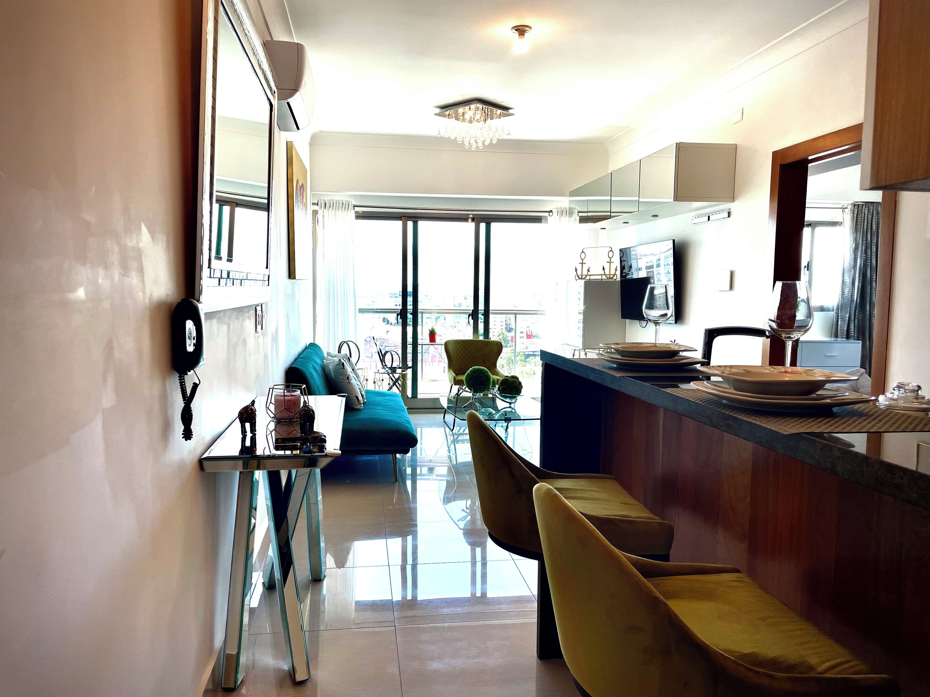 Deluxe Apartment, Balcony, City View | Living area | 55-inch LED TV with digital channels