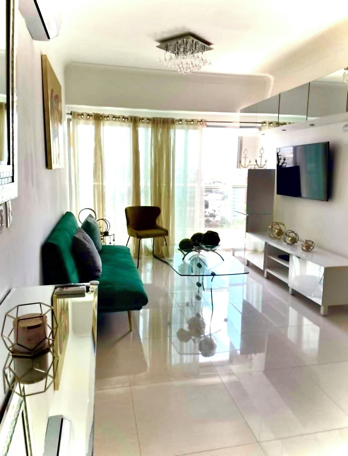 Deluxe Apartment, Balcony, City View | Living area | 55-inch LED TV with digital channels