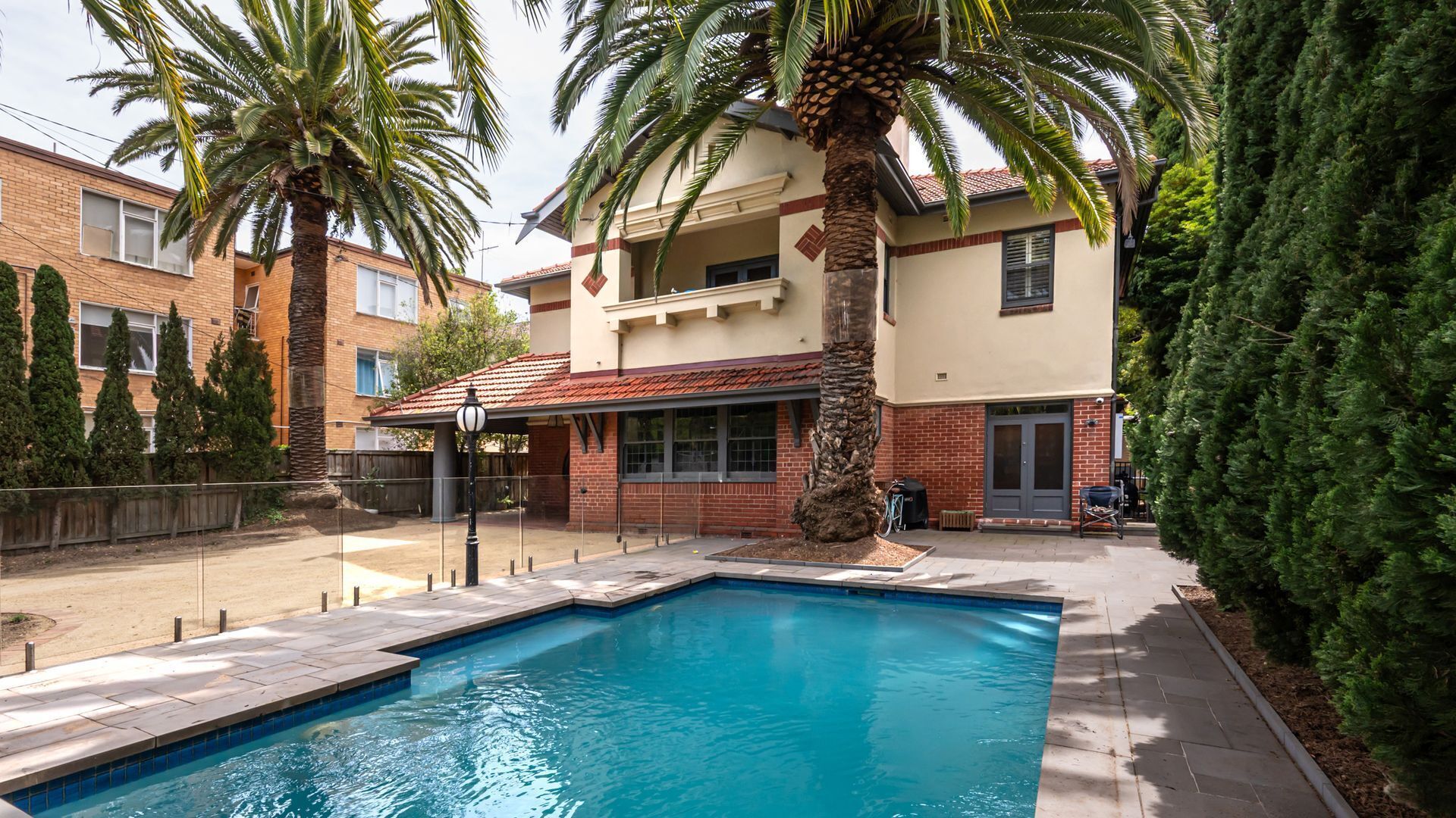 Large secure yard with solar heated pool 