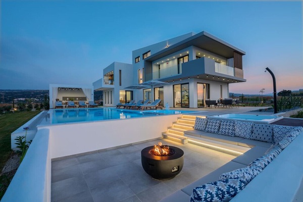 Stunning villa exterior overlooking scenic surroundings.