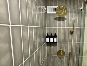 Shower, hair dryer, towels, soap