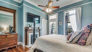 A bedroom with a bed, dresser, and a ceiling fan. - Pensacola 1 BR Sleeps 2 Suite in East Hill (Pensacola)