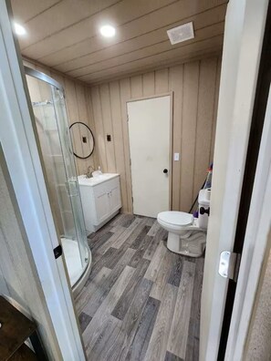 Shower, towels, soap, toilet paper