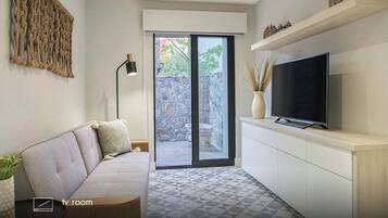 Casita Jamaica | Woonruimte | Een 58-inch ledtelevisie met kabelzenders