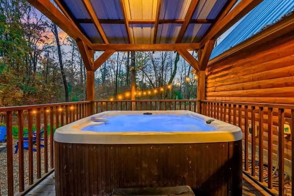 Unwind under the stars in the private covered hot tub,
